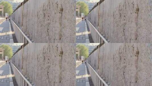 静态拍摄沿墙壁行走的人高清在线视频素材下载