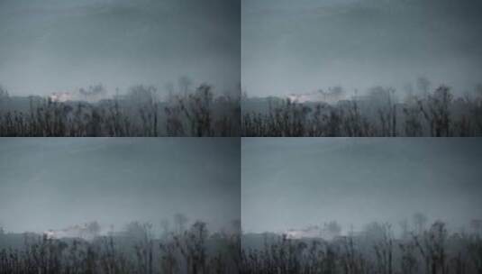 乡村视频云南山区烟雾下隐藏村庄轮廓高清在线视频素材下载