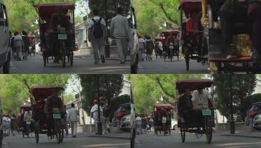 北京什刹海骑三轮车三轮车夫旅游胡同旅游高清在线视频素材下载