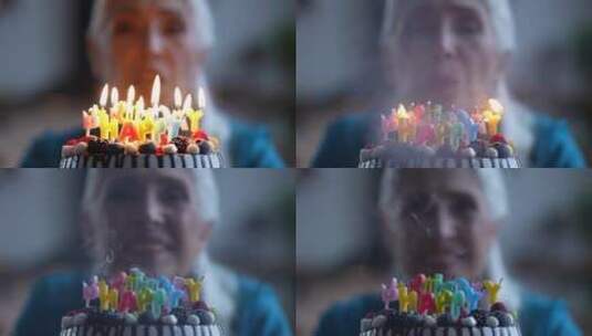 老人吹灭生日蛋糕上的蜡烛高清在线视频素材下载
