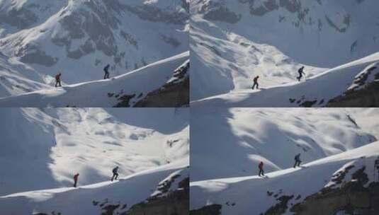 在雪山山脊上行走的登山者高清在线视频素材下载