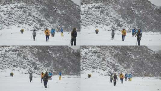 攀登岷山山脉都日峰的登山者在雪中徒步行进高清在线视频素材下载