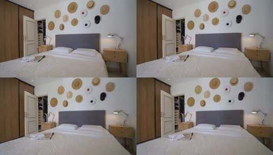 一张双人床和墙上的草帽高清在线视频素材下载