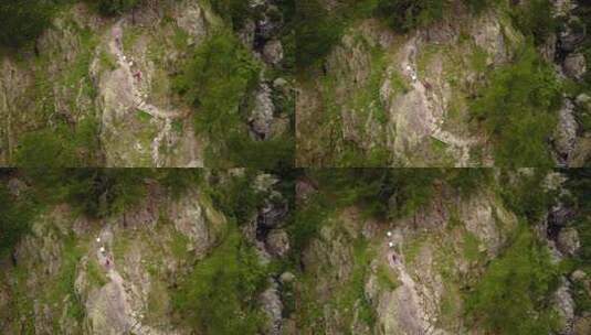 山的俯视图：人们走在自然的小径上。瑞士阿尔卑斯山，空中高清在线视频素材下载