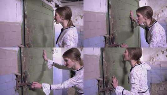 受惊的女人把自己锁在地下室试图打开锁门高清在线视频素材下载