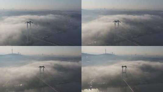 土耳其伊斯坦布尔雾天博斯普鲁斯桥烈士桥的航拍视频高清在线视频素材下载
