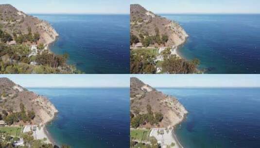 Flyby Descando Beach，Catalina岛，加利福尼亚州。展示部分海滩和岩石山坡高清在线视频素材下载