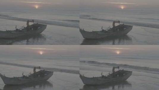 青岛大海沙滩上的船夕阳高清在线视频素材下载