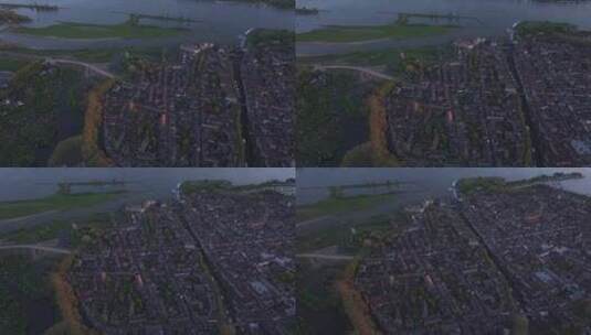 荷兰日落时城市、河流、建筑物和街道的鸟瞰高清在线视频素材下载