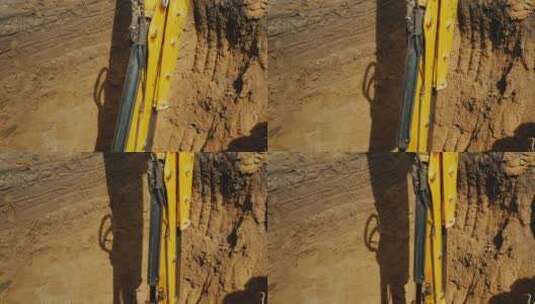 挖掘机铲斗在深坑中挖土高清在线视频素材下载