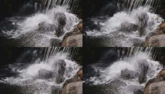 水流瀑布击打石头高清在线视频素材下载