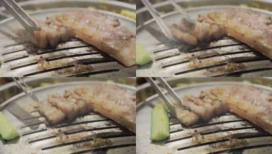 4k慢动作韩式烤肉肉在铁板上烤制滚油拨动高清在线视频素材下载