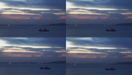 夜晚船只蓝色大海情绪傍晚海边一只孤船宁静高清在线视频素材下载