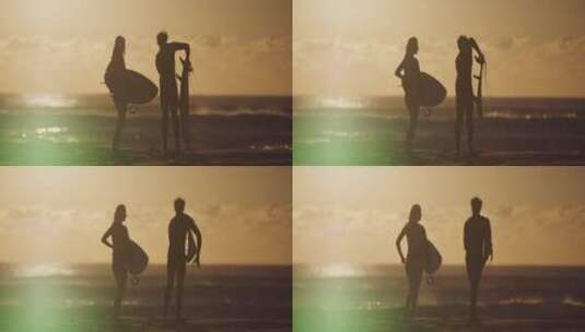 情侣在海边冲浪剪影高清在线视频素材下载