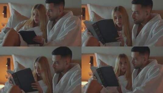 情侣在床上阅读高清在线视频素材下载