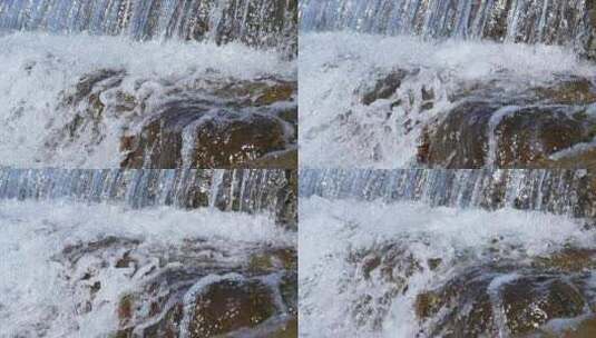 清澈的溪流水流和白色的水花慢镜头高清在线视频素材下载
