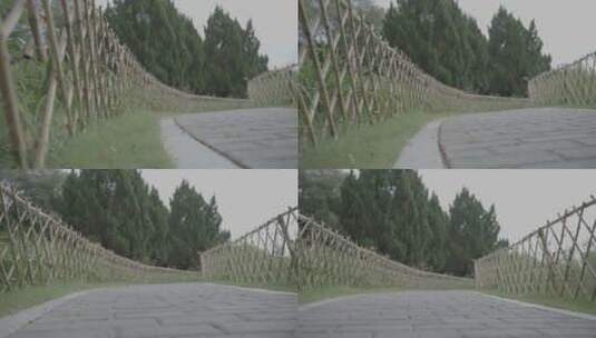 公园竹篱笆铺砖道路高清在线视频素材下载
