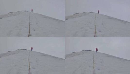 登顶川西格聂山区阿萨贡格雪山的登山者下撤高清在线视频素材下载