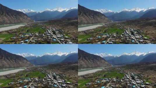 航拍西藏林芝南迦巴瓦峰雪山下的村庄河流高清在线视频素材下载