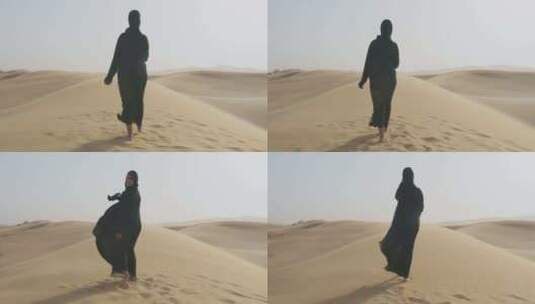 戴着防沙头巾的女人赤脚走在沙漠高清在线视频素材下载