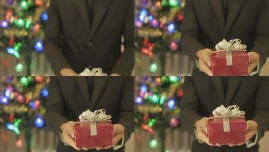 男人送出圣诞节礼物的特写镜头高清在线视频素材下载