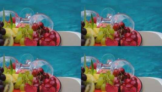 唯美浪漫户外海边泳池漂浮水果特写高清在线视频素材下载