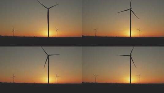 夕阳下的风车风力发电高清在线视频素材下载