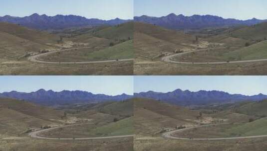 摩托车经过远处的山路高清在线视频素材下载