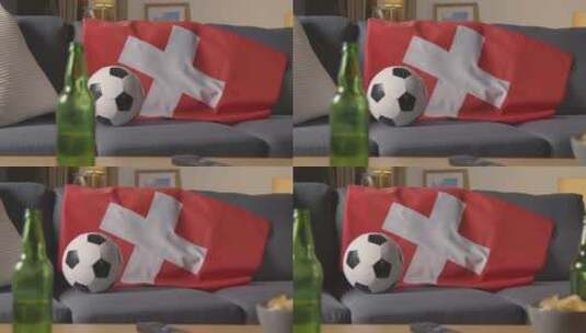 沙发上的瑞士国旗和足球特写高清在线视频素材下载