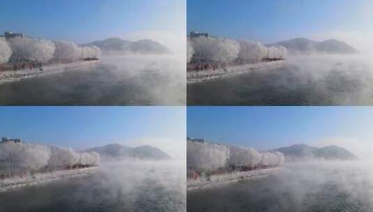 航拍吉林松花江沿岸雾凇下的人群高清在线视频素材下载