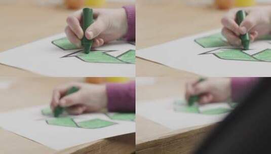 孩子使用绿色蜡笔涂色高清在线视频素材下载