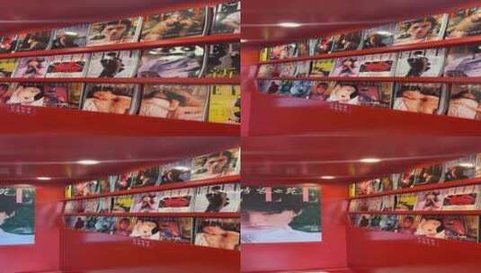商场里潮流时尚的红色报刊亭，满墙时尚杂志高清在线视频素材下载