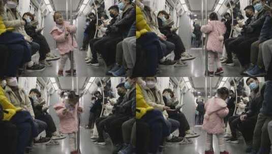 小女孩在地铁玩耍乘客带口罩高清在线视频素材下载