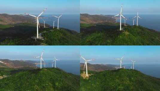 航拍风力发电设备山脉海边高清在线视频素材下载