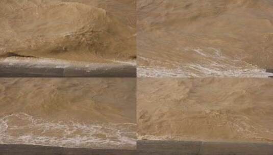 洪水过境拍打岸边堤坝实拍视频高清在线视频素材下载