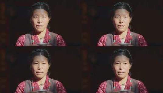 藏族妇女举起酒杯微笑高清在线视频素材下载