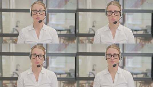 带耳机的成熟女人与客户交谈高清在线视频素材下载