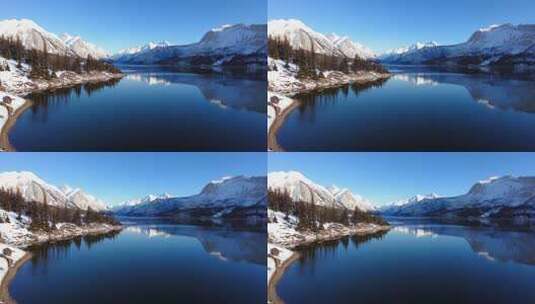 雪山下平静湖水的壮丽自然风光高清在线视频素材下载