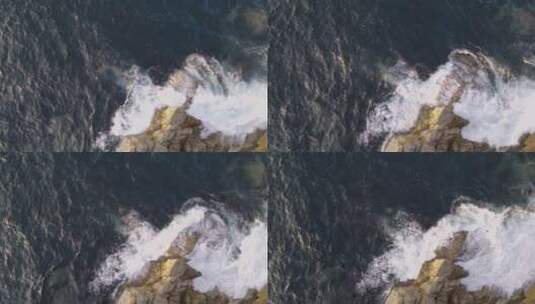 海浪冲破岩石海岸的鸟瞰图高清在线视频素材下载