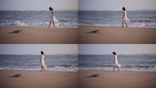 白衣裙子少女再海边慢慢行走高清在线视频素材下载