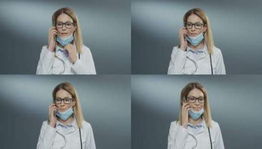 医生戴着口罩打电话高清在线视频素材下载