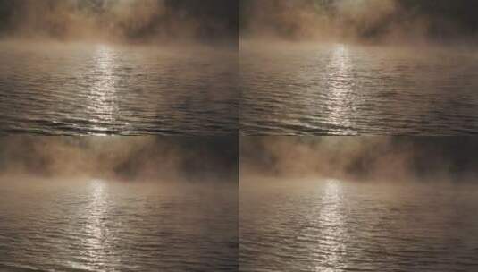清晨阳光照射在雾气腾腾的湖面上高清在线视频素材下载