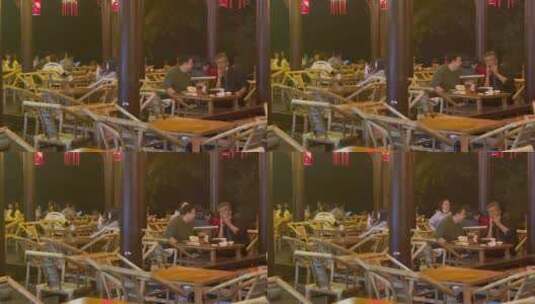 夜晚公园竹编椅喝盖碗茶的人们高清在线视频素材下载