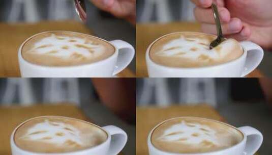 用勺子挖咖啡的奶泡高清在线视频素材下载