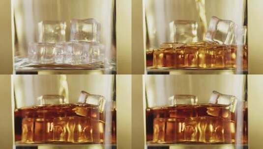 威士忌倒入装有冰块的杯中的特写镜头高清在线视频素材下载