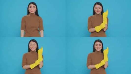 女人微笑演示戴上黄色橡胶手套高清在线视频素材下载