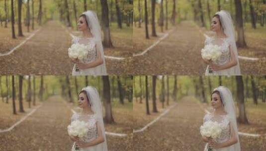 新娘在公园手拿花束高清在线视频素材下载