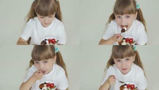 女孩在吃酸奶水果高清在线视频素材下载