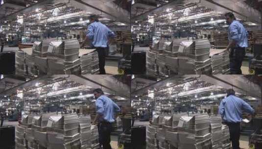 工人在印刷厂堆报纸高清在线视频素材下载