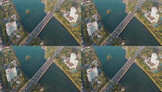 航拍南湖大桥上的车流，公园与城市高清在线视频素材下载